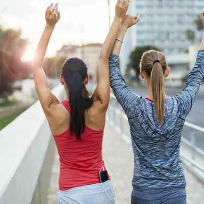 Two women happy after finishing exercises