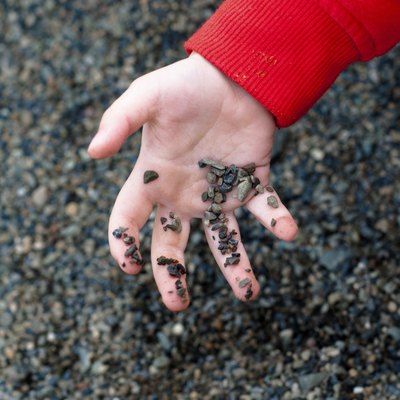 little hand holding pebbles