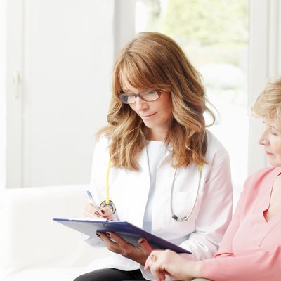 Female doctor with senior patient