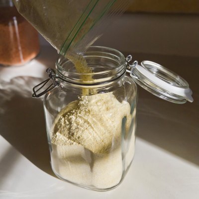 Pouring Cornstarch Into a Glass Jar