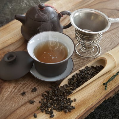 Cup of oolong tea and accessories