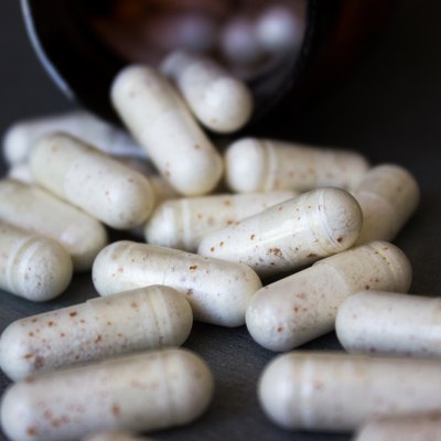 medicine bottle with scattered pills