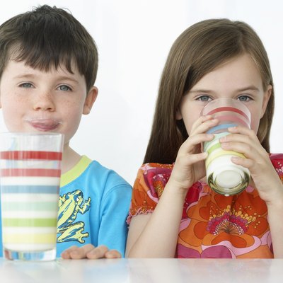 Boy and Girl Drinking Milk Shakes