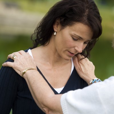 Senior woman consoling her daughter