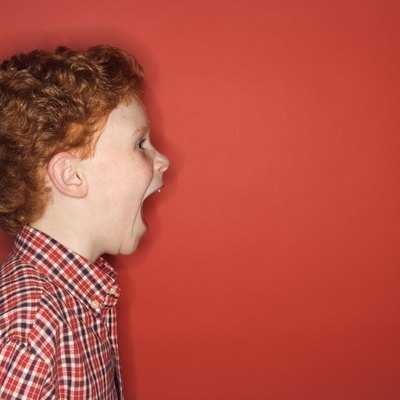 Studio shot of boy screaming