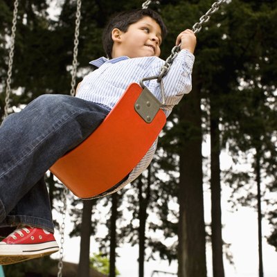 kids on swing in park