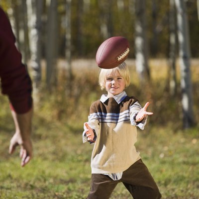 Father and son playing football