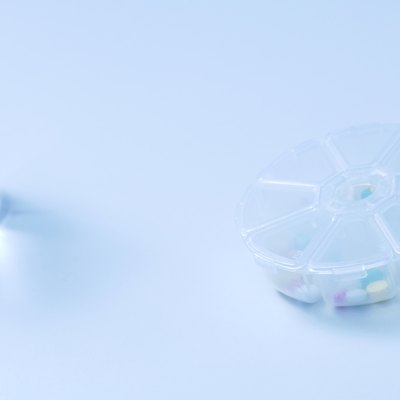Glass of water and pill case