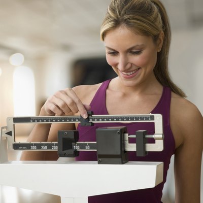 Woman weighing herself