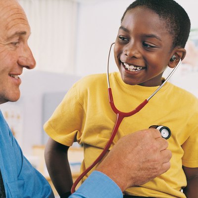 Doctor Explaining Stethoscopes to Boy