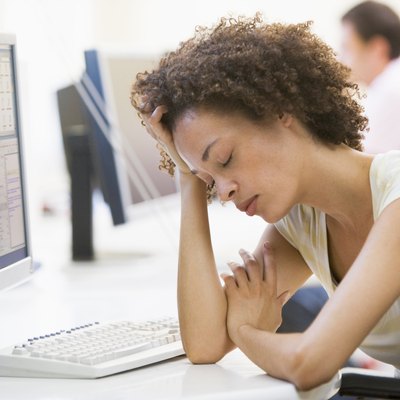 Woman in computer room sleeping