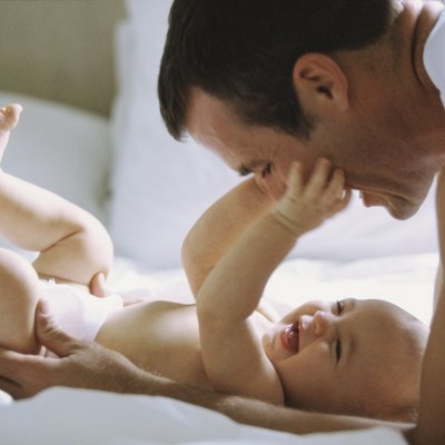 Side profile of a father playing with his daughter