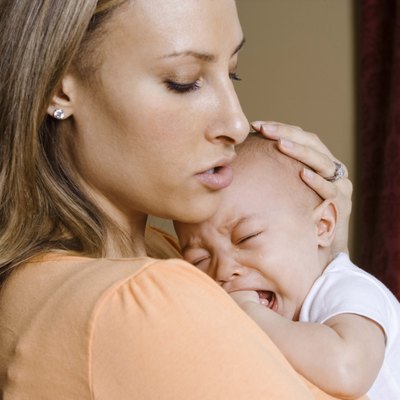 Mother holding crying son