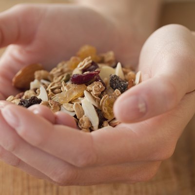 Woman holding granola in hands