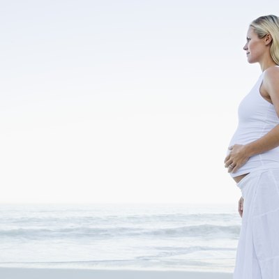 Pregnant woman on beach