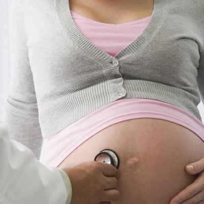 Doctor examining pregnant woman