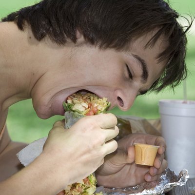 Close-up of a young man eating