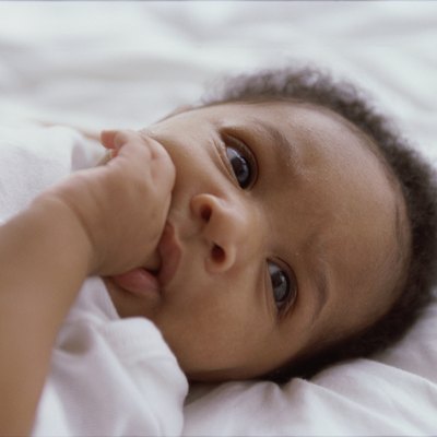 Close-up of a baby boy sucking his thumb