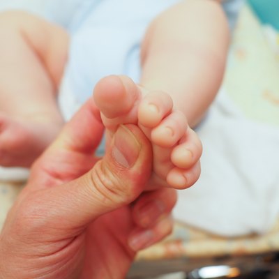 Baby receiving foot massage