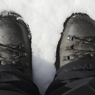 Hiking boots on snow, top view