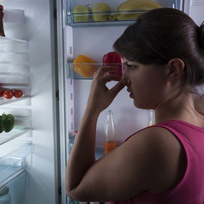 Woman holding nose