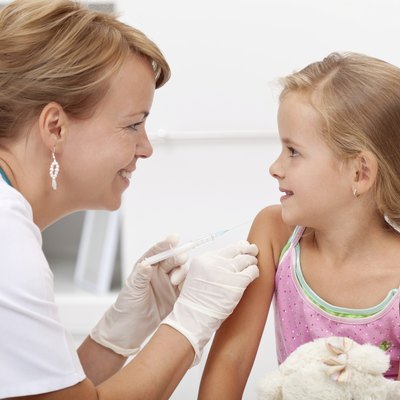 Brave little girl receiving injection