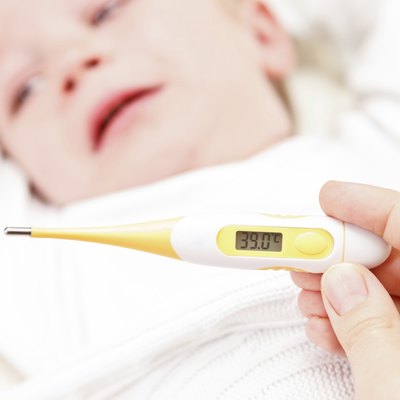 Fever, measuring temperature for little boy