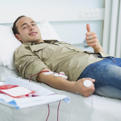 Smiling transfused patient lying on a bed