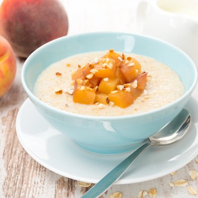 oatmeal with caramelized peaches in a bowl and yogurt