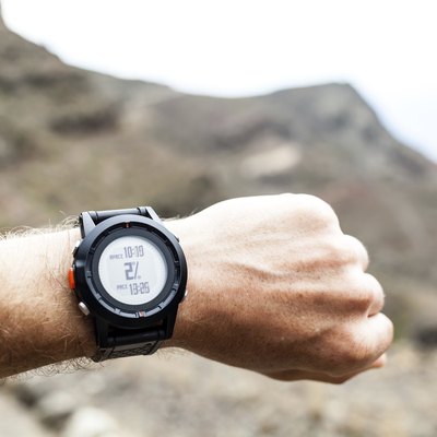 Runner looking at sport watch