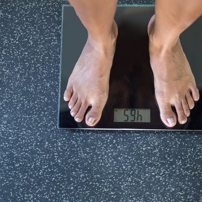 Standing on weight scale
