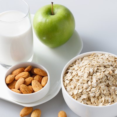 "Oatmeal with almonds,apple and glass of milk"