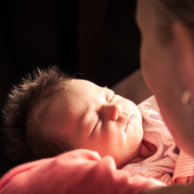 Newborn baby on mother hands