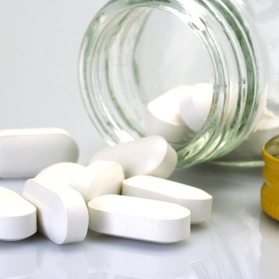 Pills spilling out of pill bottle