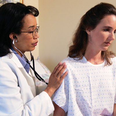 Doctor Inspecting Woman