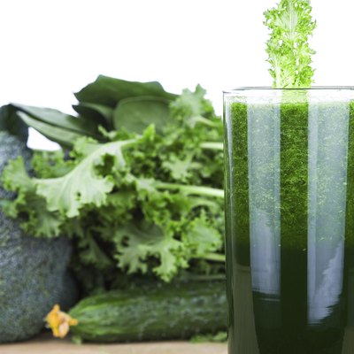 Green vegetable juice isolated on white background