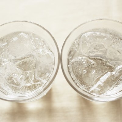 Glasses of soda on table, close up