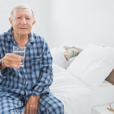 Old man with a water glass