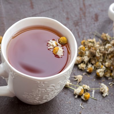 Herbal tea with chamomile flowers