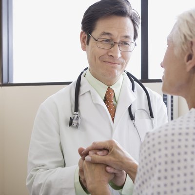 Doctor and patient with hands clasped