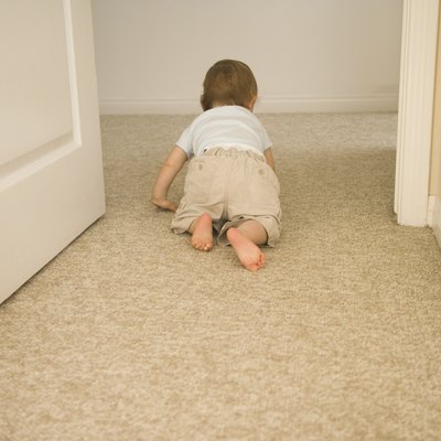 Baby crawling through doorway