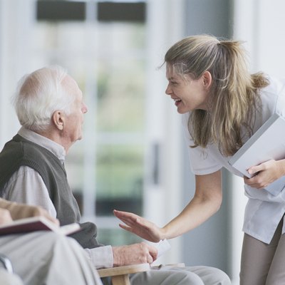 Nurse with man on porch
