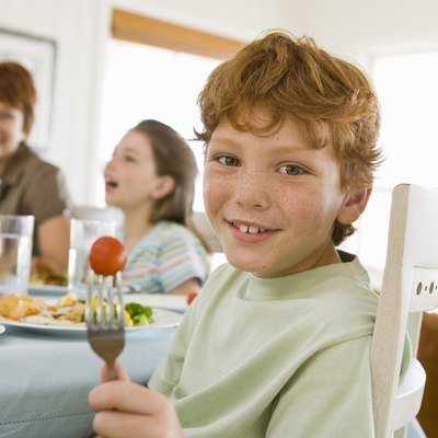 Boy eating at table