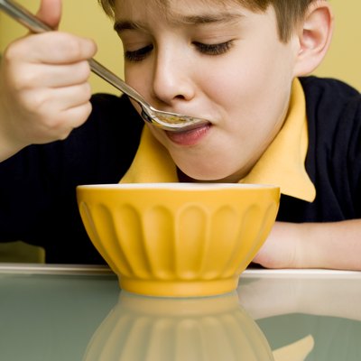 Boy eating at table