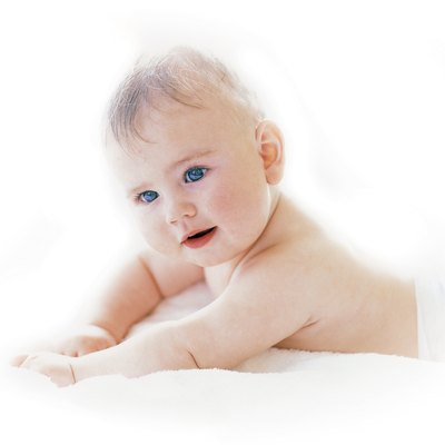 Baby (6-12 months) lying on a bed