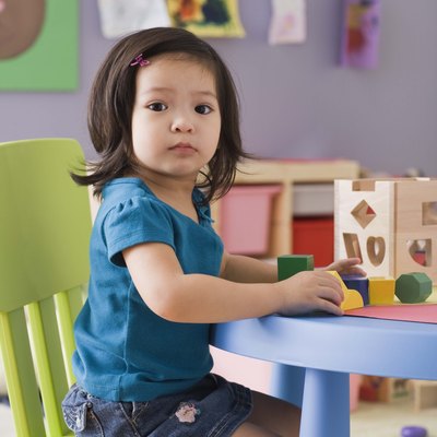 Toddler playing with blocks at daycare