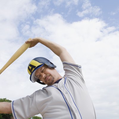 Serious baseball player stretching