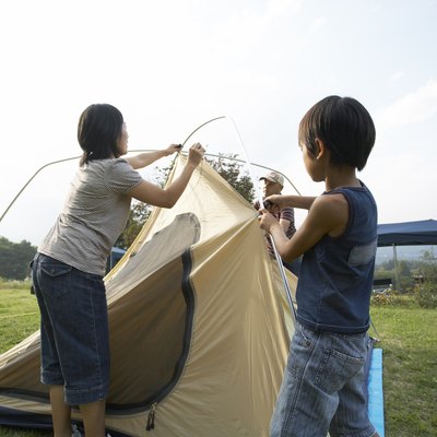 Japanese famliy preparing a camping tent