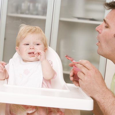 Father feeding baby