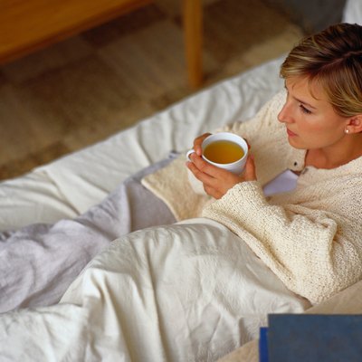 Young Woman Relaxing with a Cup of Tea